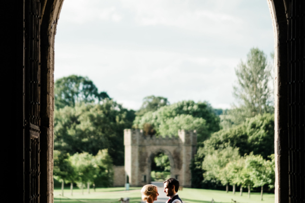 Couple in drawthrough with driveway behind