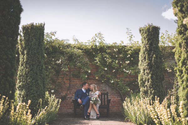 Couple on a bench after the wedding ceremony