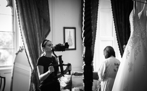 Photographer taking a picture of wedding dress
