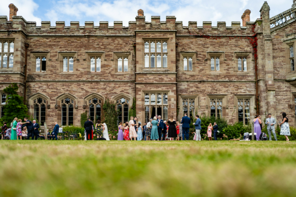 Wedding guests mingling on Castle south lawns