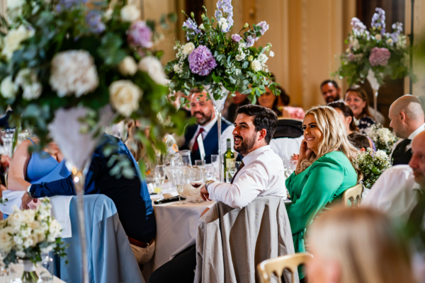 Wedding guests look on during speeches