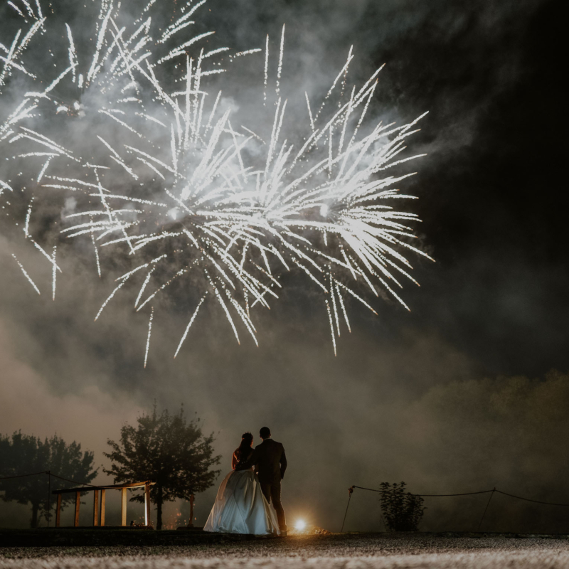 bride and groom watching fireworks at Hampton Court Castle wedding