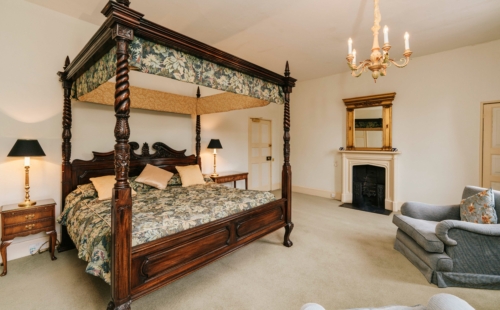 Fourposter bed in ornate formal room